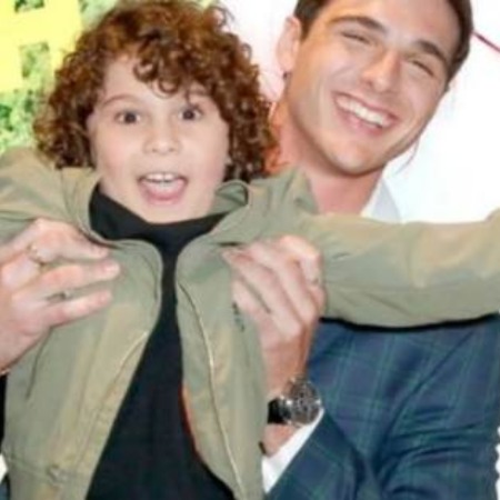 Jacob Elordi holding Michael Miccoli.